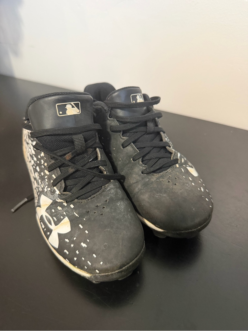 Under Armour Kids Black and White Baseball Cleats with MLB Logo